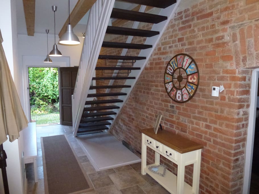 Access the kitchen, living room and utility room from the hallway