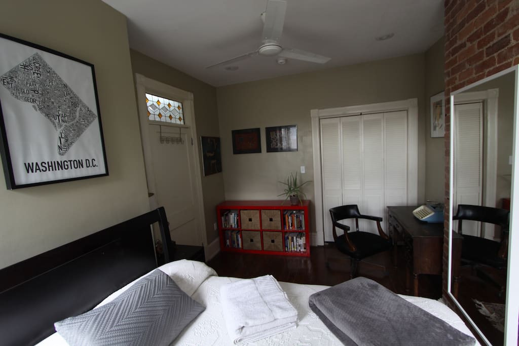 Bedroom with desk, night stand and book shelf