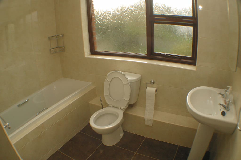 Bathroom with electric shower.