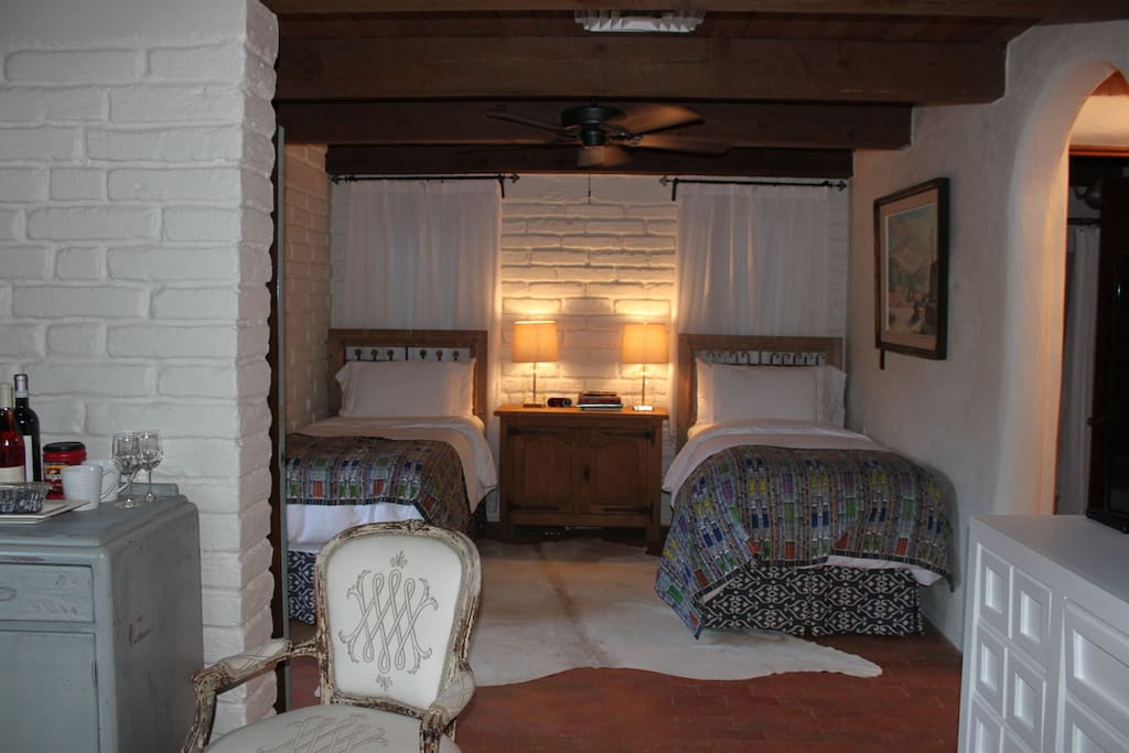 Twin Beds with Cowhide Rug