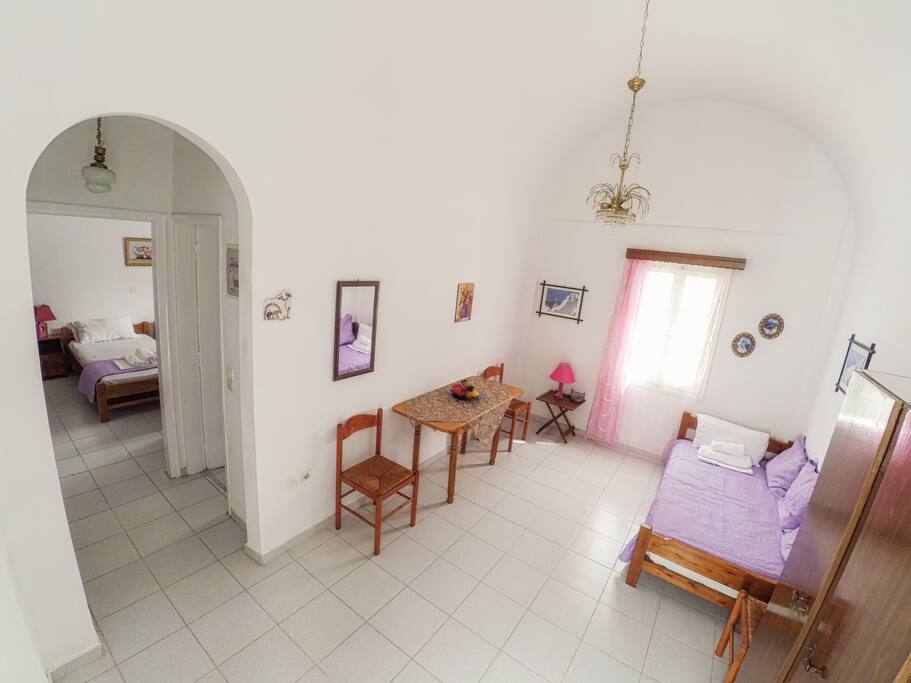 Traditional Cycladic living room, hallway to bathroom, bedroom and kitchen.