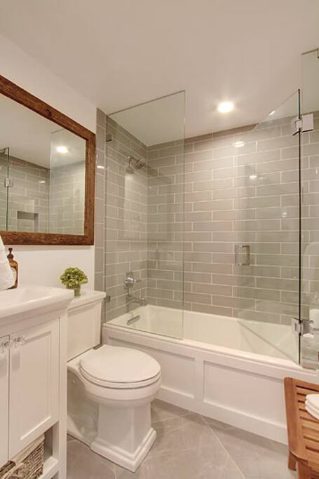 Modern bath with spa-like shower/tub and frameless glass door!