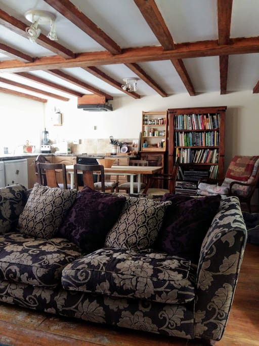 The open plan living space offers a large comfy sofa to cwtch up in.