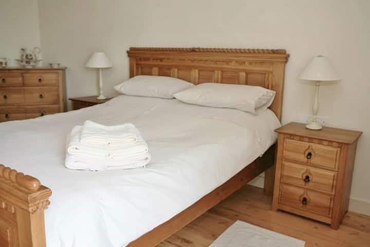 The Master Bedroom downstairs features a  king size bed and a shower room 