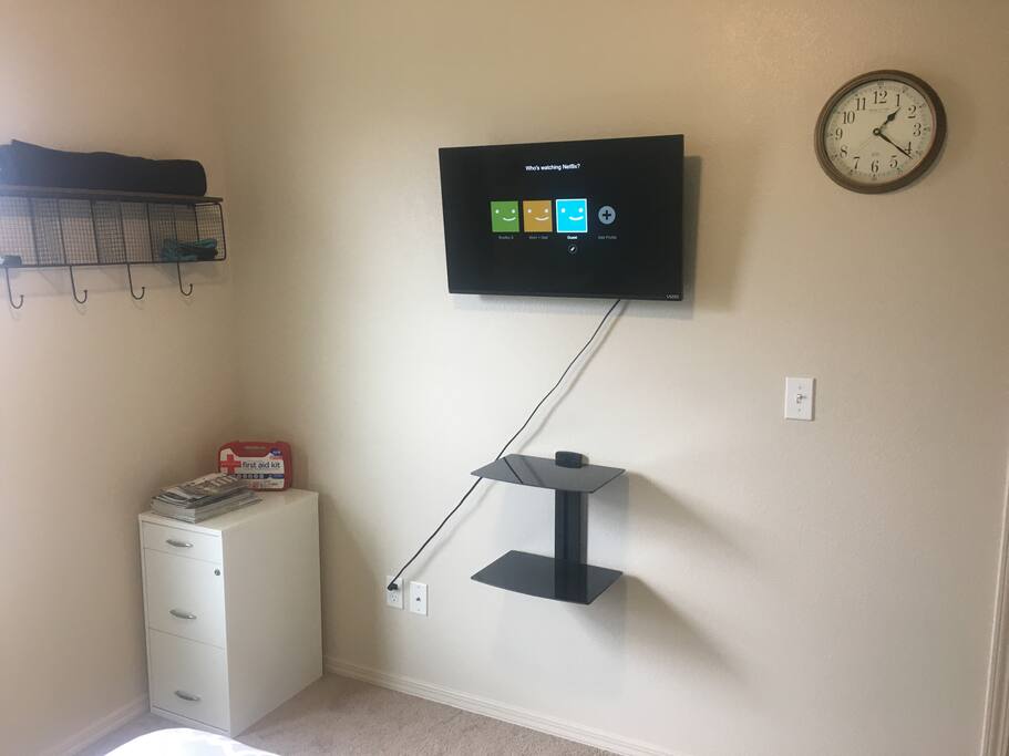 Smart 32” TV with Netflix (Guest), clock, locking file cabinet and rack