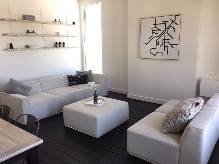 Open plan living and dining area with stunning views across Fitzroy and the city.