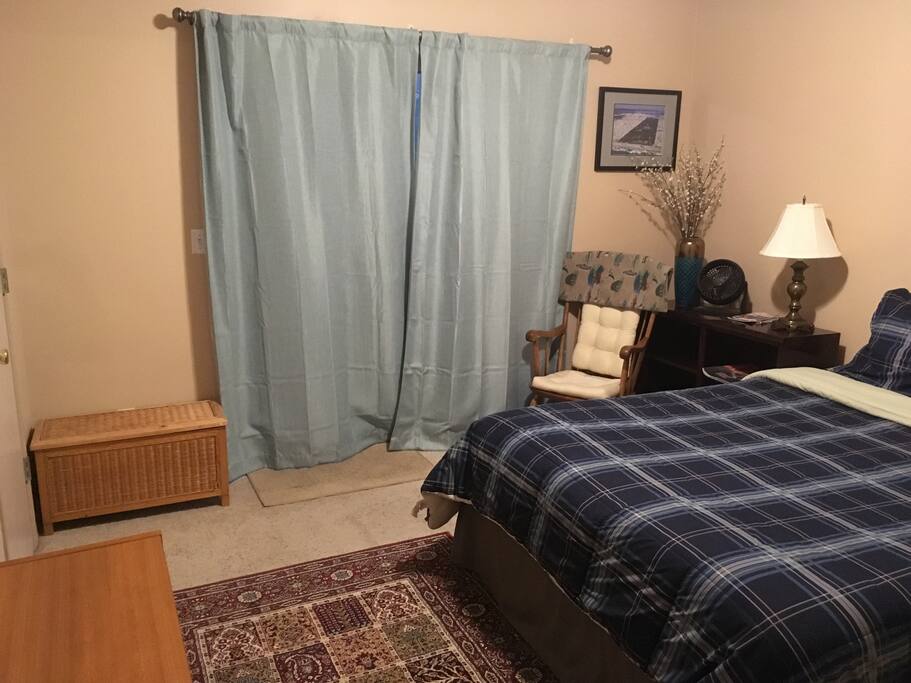 Sliding door to outside and a couple areas to store luggage/clothing. Also walk-in closet to left for lots of extra space!