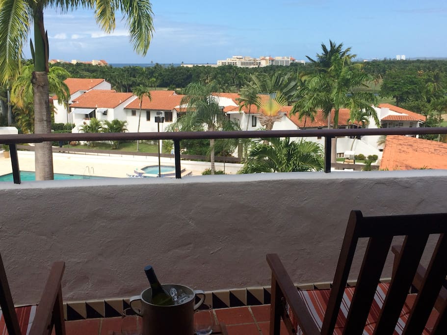 Enjoy a glass of wine overlooking the pool