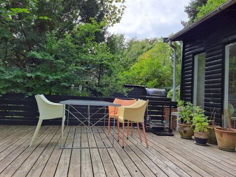 Cabin by the sea with tree top deck + wild garden
