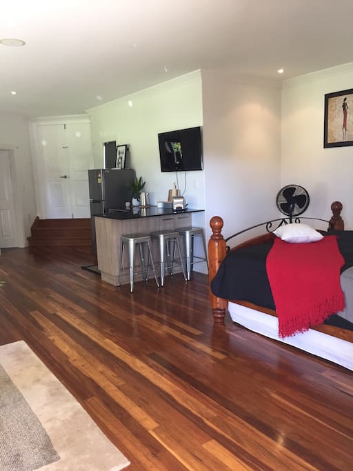 King size bed and wall mounted TV