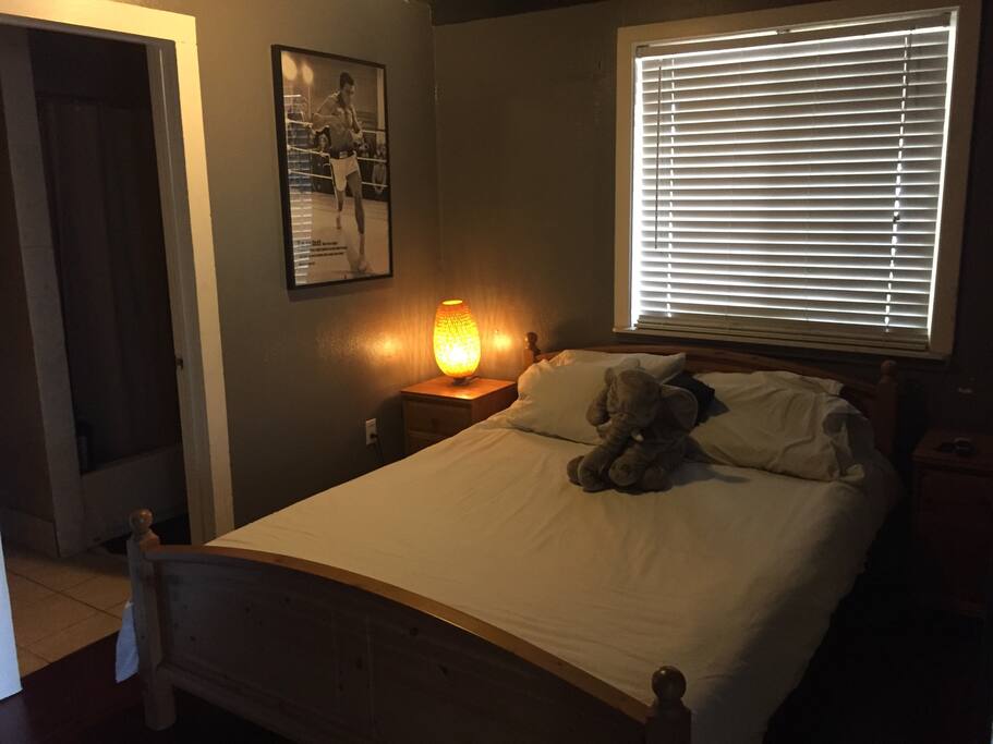 Full bed and two night stands with full restroom access.
