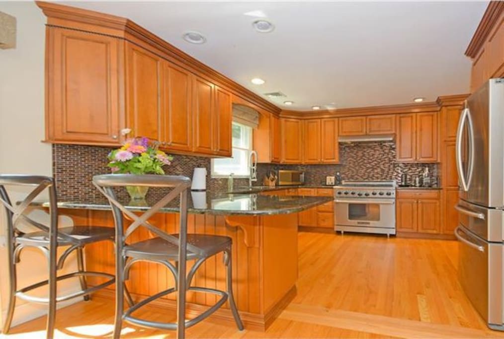 Gourmet kitchen with 6 burner stove.