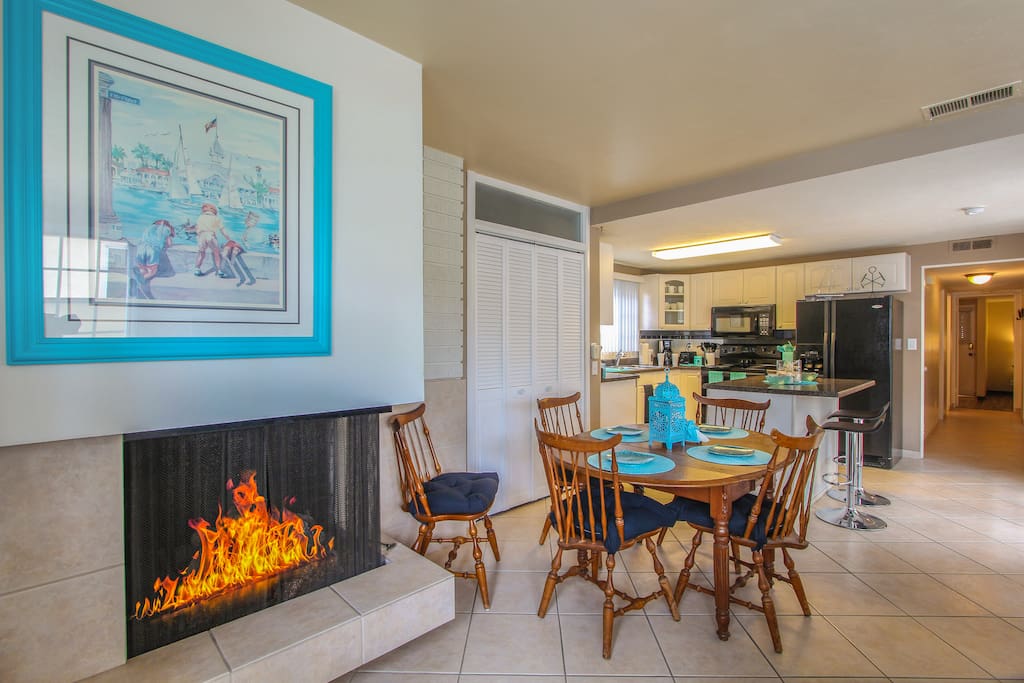 A gas fireplace warms the 6-person dining area.