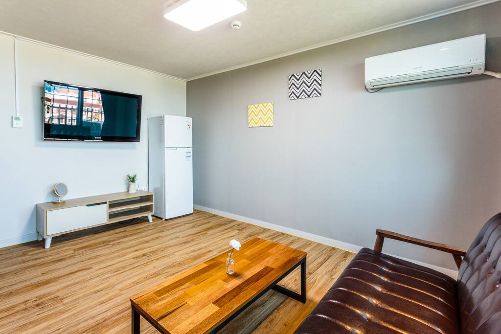 A living room with a TV