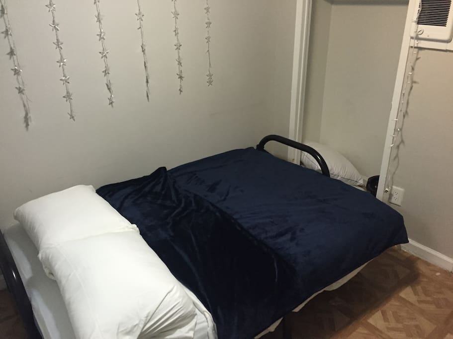 Bed is a comfy full sized futon. Brand new.
