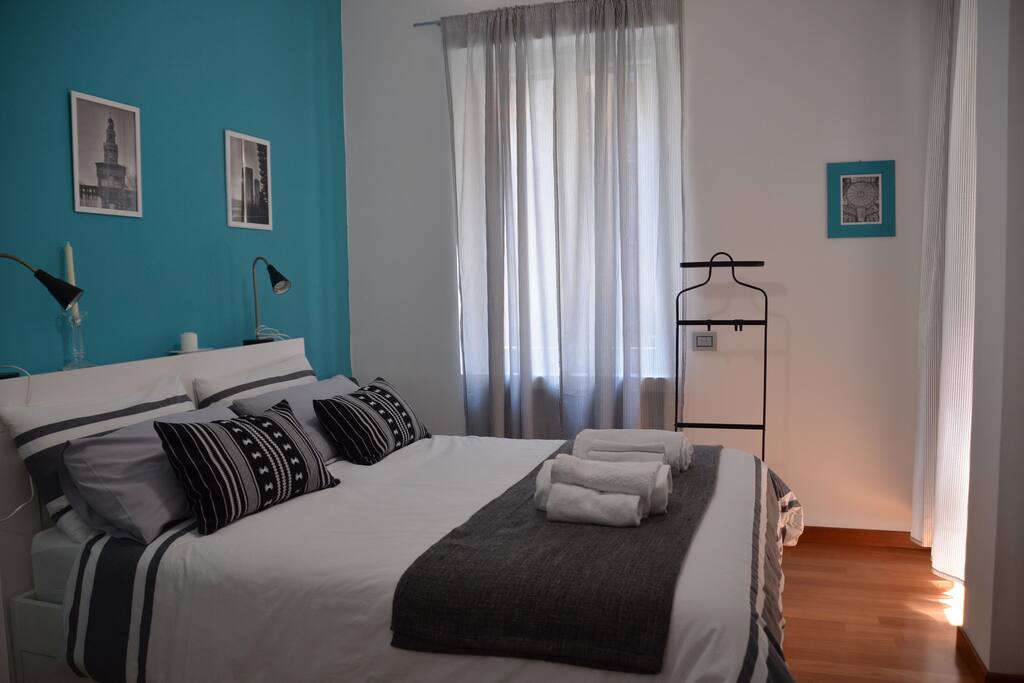 Double bed with the most common chargers you need at the night stand: Micro USB, USB C, Lightning