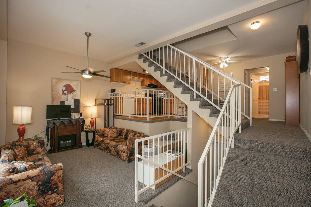 The living room is furnished with 2 matching sofas that face each other for easy conversation