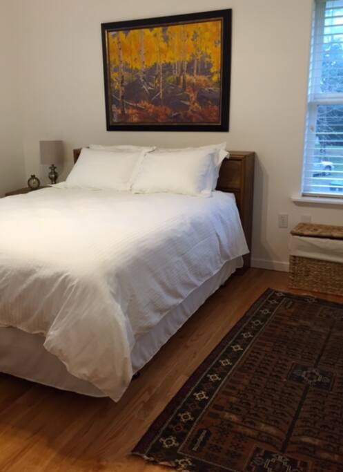 Brand new queen sized bed with Egyptian cotton sheets and duvet.