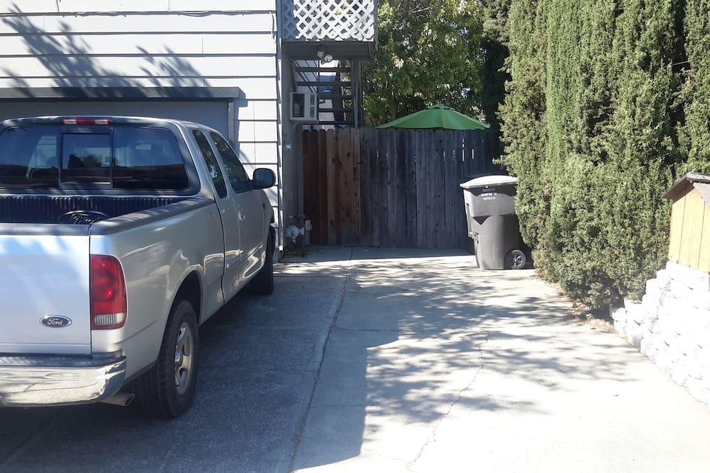 Driveway parking spot with private entrance.