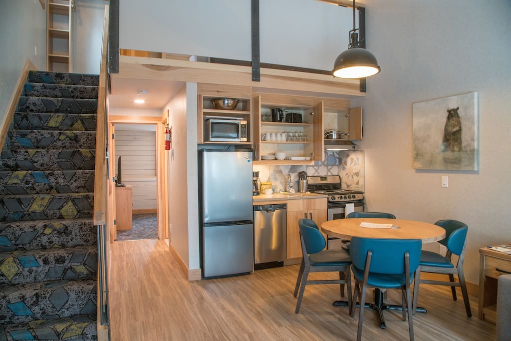 Our open and bright living area features a functional kitchenette and a dining area.