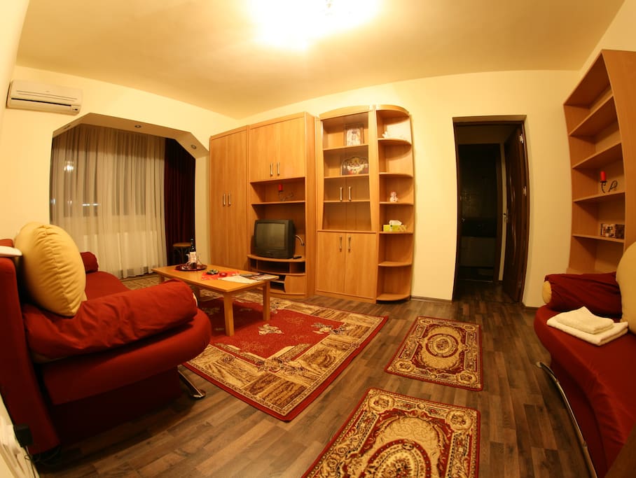 A big living room with two sofa beds.