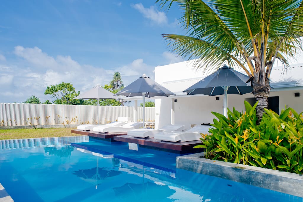 Pool with sun bed deck.