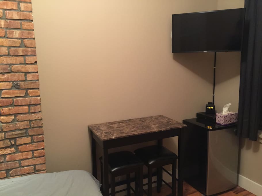 TV with Fios digital cable, mini fridge, and dinette!