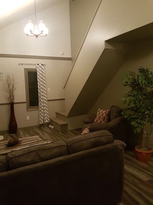 living room and stairs to 2 bedrooms