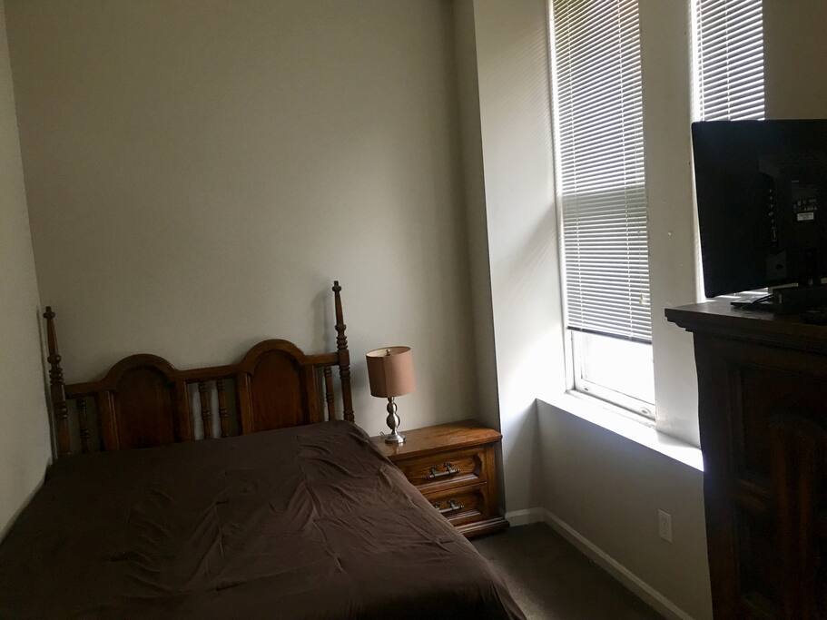 Comfy bedroom overlooking the corner of 13th and Walnut!
