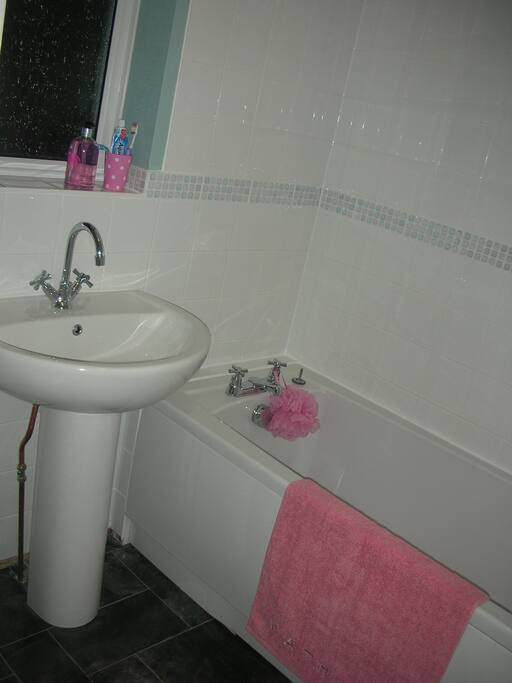 Clean and functional bathroom with bath/shower, only fitted two years ago