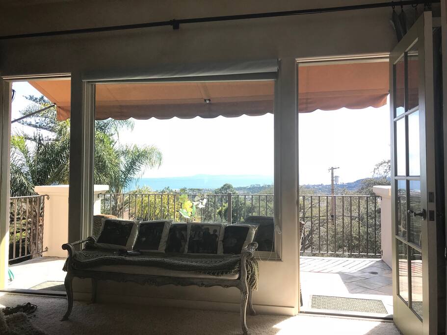 Big balcony with city and ocean views. 2 nice chairs to relax and enjoy