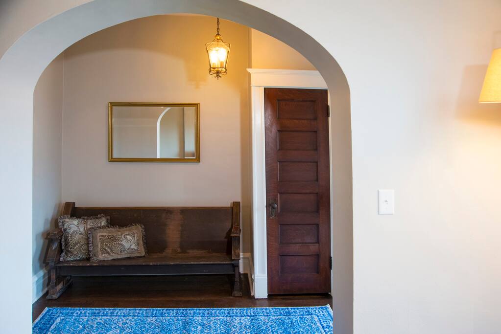 Front entry with 100 year old church pew