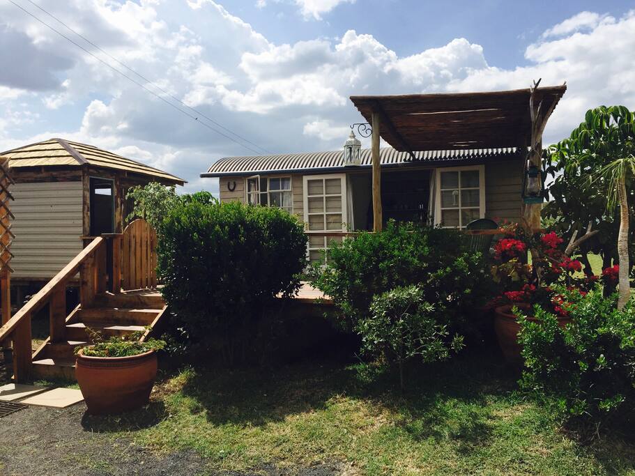 Bramble hut with attached deck and private bathroom.