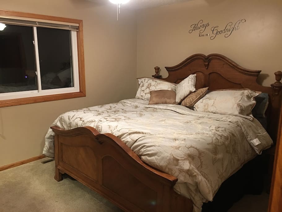 Master bedroom, attached to bathroom (king bed). Night stands and dresser.
