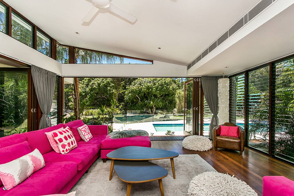 Watch the kids play in the pool while lounging in luxury