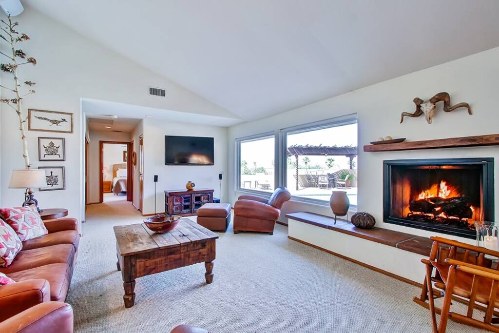 Kick back with loved ones while a movie plays on the flat screen cable TV.