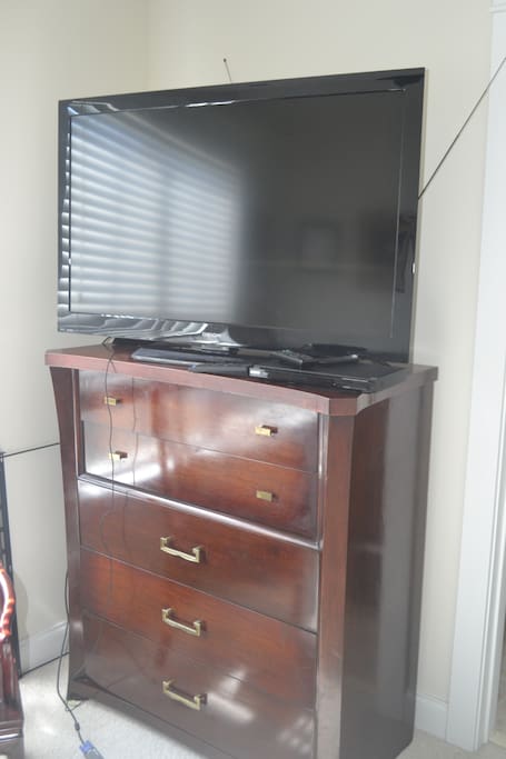 Dresser and high-definition TV. Access to Prime and Kindle Fire programs