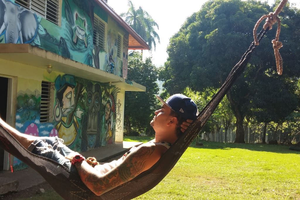 Suavecito! Our villa crew member J relaxing after hard day's work. Notice the mango and star fruit trees in the back...;}