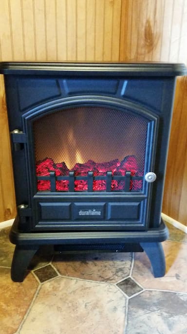 Safe electric heater to keep you toasty in winter and an air conditioner to keep you cool in summer. Plus you can close the screen door to let the fresh air flow through.