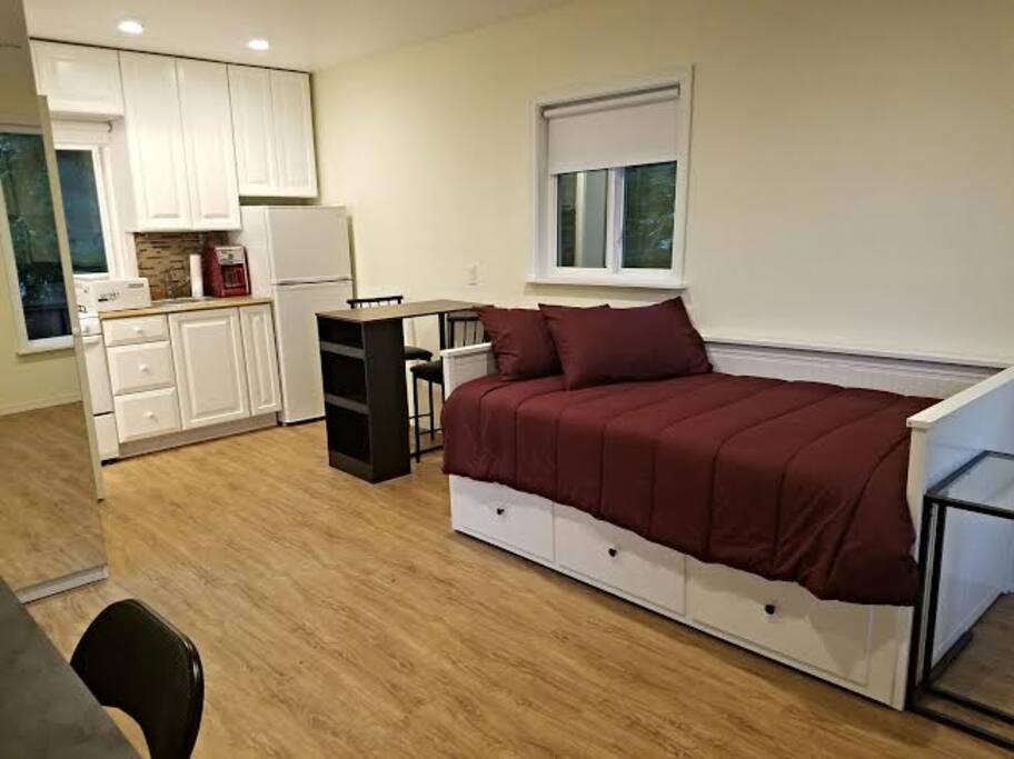 Bed and high table with stools