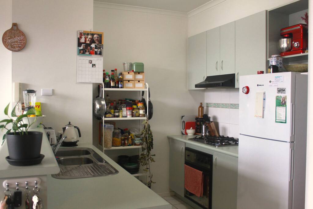 Generous kitchen looking out on to the lounge space and huge windows.