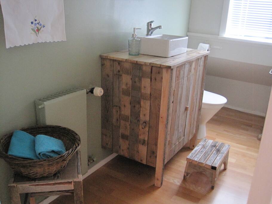 We enjoy recycling and repurposing material. Here we've made bathroom furniture out of old timber.