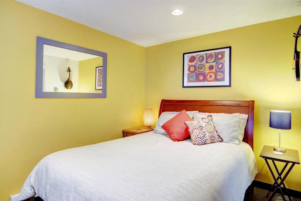 Bedroom area in separate room behind living area.