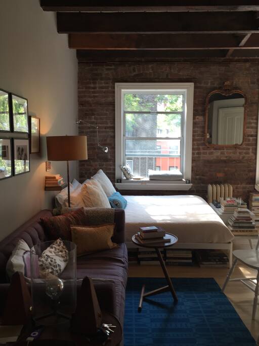 There is a comfortable queen sized bed and a small sofa.