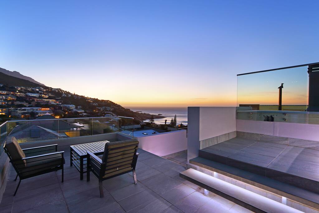 patio area overlooking the sea and gorgeous mountain views
