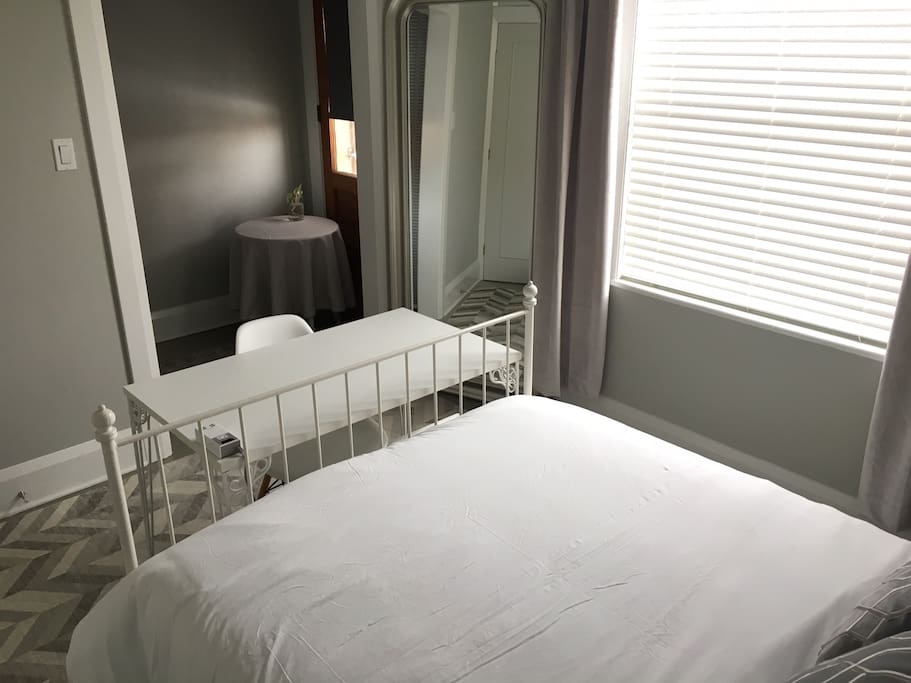Bedroom 1: Double bed, desk, closet and private bathroom with shower.
