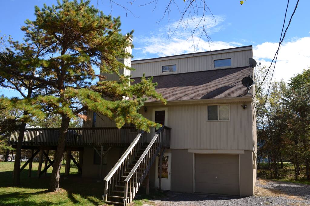 Front of home with extra parking on right