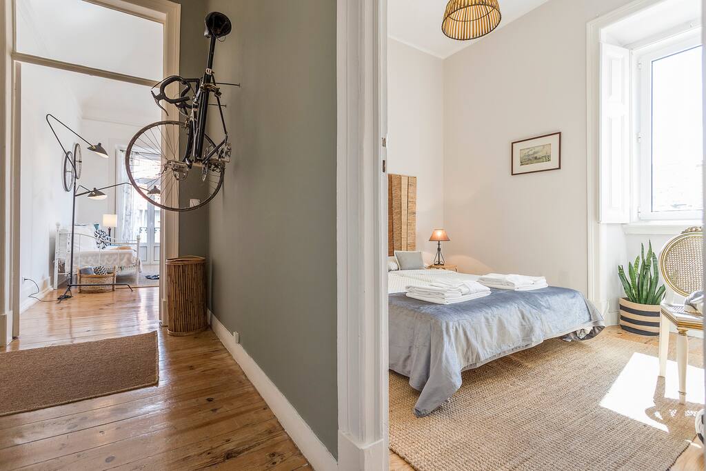 Corridor with entrance to twin room and living room.