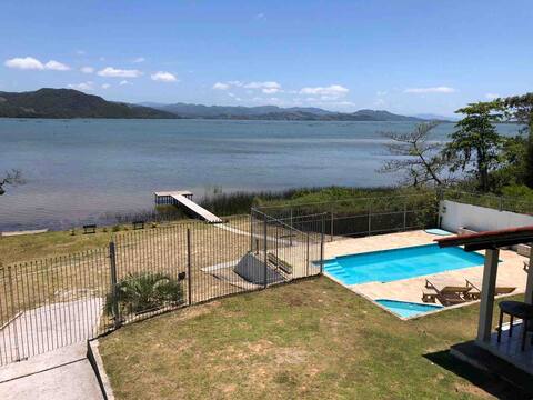 House  with pool and lagoon inside the land