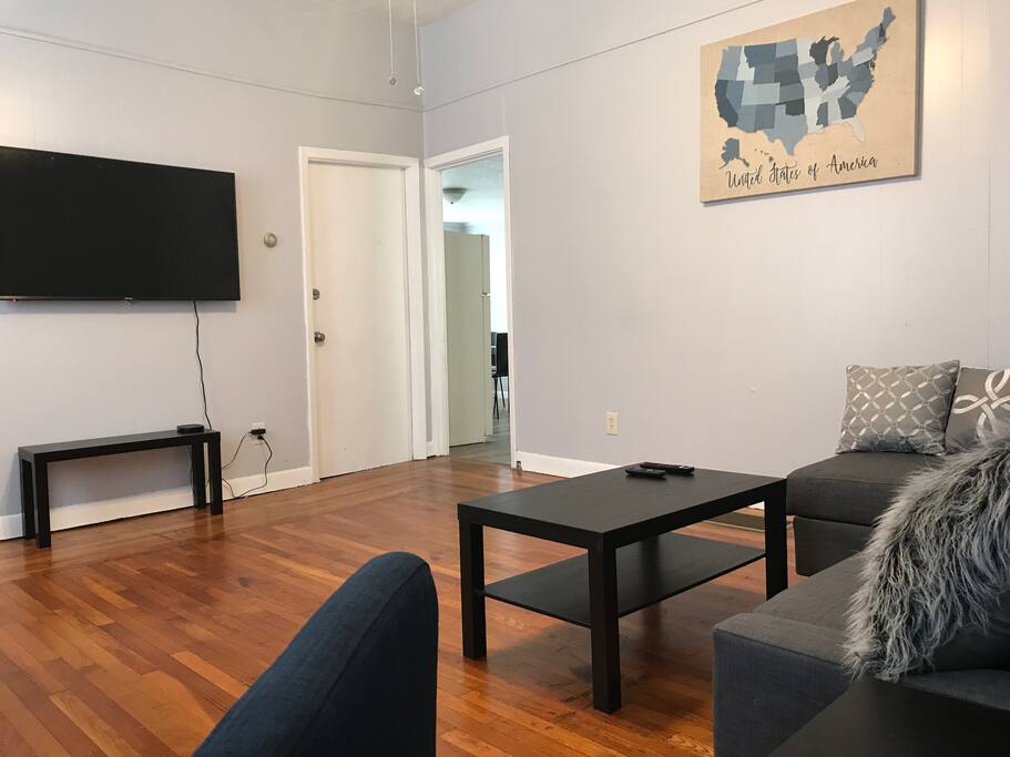 Spacious living room with sectional sleeper sofa and a 55” smart tv and high speed Fios internet